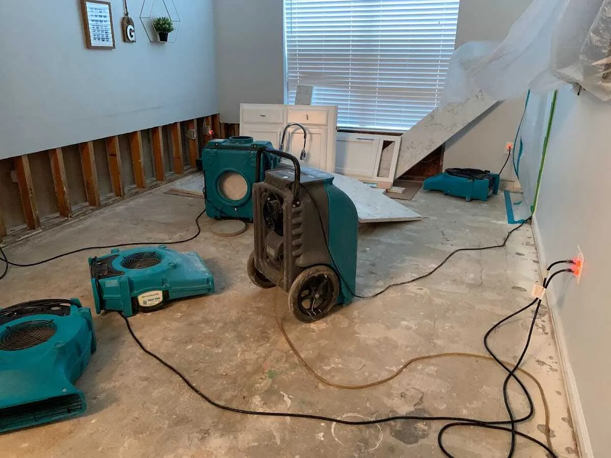 Dehumidifier in flood-cut room for Water Damage Restoration in Buxton